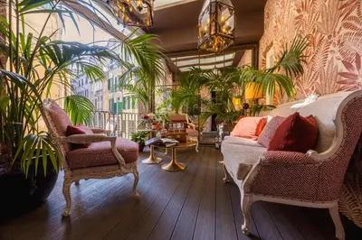a room with a staircase and a bed and a window at HT6 Hotel Roma in Rome