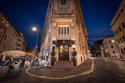 a bedroom with a canopy bed and a window at HT6 Hotel Roma in Rome