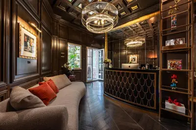 a hotel room with a bed and a desk and a window at HT6 Hotel Roma in Rome