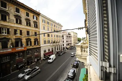 a view of a city street with cars and buildings at The Roman Empire Guesthouse in Rome