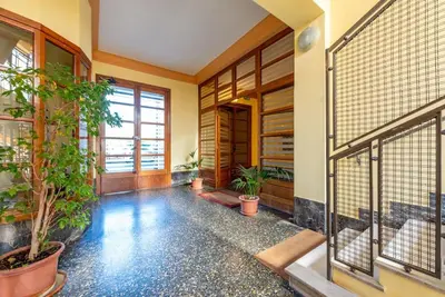 a hallway with potted plants in a building at Casa Maria al Flaminio in Rome
