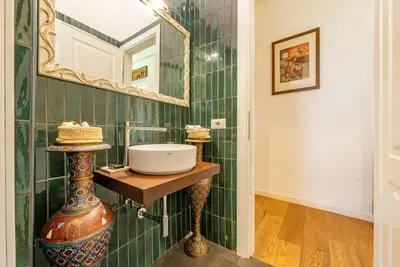 a bathroom with a sink and a mirror at Casa Maria al Flaminio in Rome