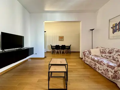 a living room with a couch and a table at JHHIT - In the heart of Rome near the Colosseum in Rome