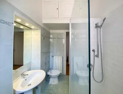 a bathroom with a sink and a toilet and a shower at JHHIT - In the heart of Rome near the Colosseum in Rome