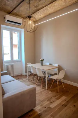 a dining room with a table and chairs at Home Holiday Rome - San Lorenzo in Rome
