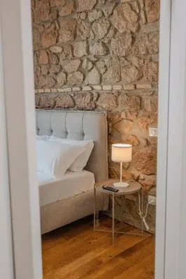 a bedroom with a bed and a table with a lamp at Home Holiday Rome - San Lorenzo in Rome