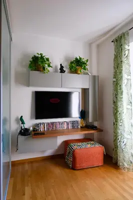 a living room with a flat screen tv on a wall at Granma Apt in Rome