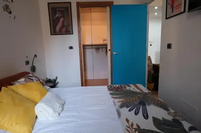 a bedroom with a bed and a blue door at Granma Apt in Rome