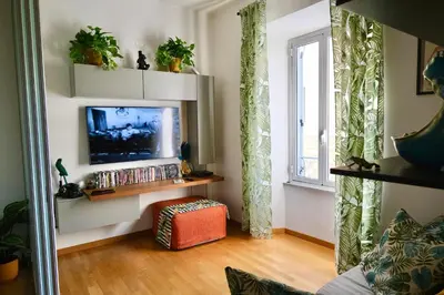 a living room with a television and a window at Granma Apt in Rome