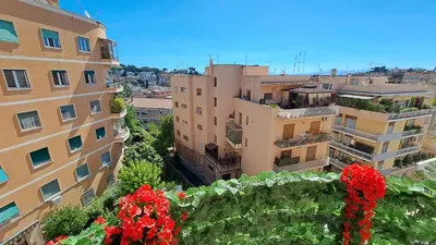 a view of a city with buildings and flowers at Elegante Appartamento Vaticano Lattanzio in Rome