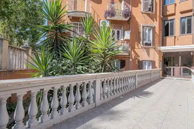 a balcony of a building with trees and plants at Happy Home in Rome