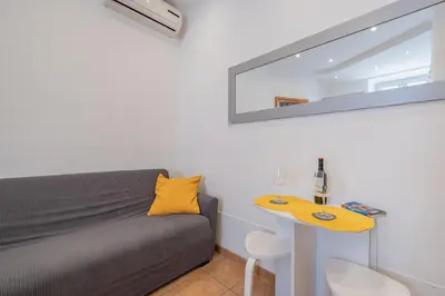 a small room with a bed and a table at Happy Home in Rome