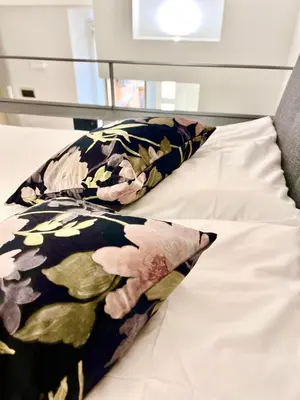 a bed with a blanket and a pillow on it at Silla Studiò - piccolo appartamento a due passi dal Vaticano in Rome