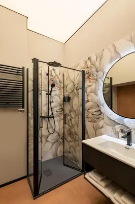 a bathroom with a shower and a sink at San Giovanni Luxury Rooms in Rome