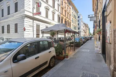 a small white car parked on the side of a street at Pretorius Design Loft - Near Termini Station by RHR in Rome