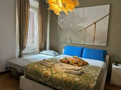 a bedroom with a bed with towels on it at Casa di Egeria al Colosseo in Rome
