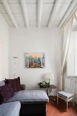 a living room with a couch and a chair at Casa Mandes Spanish Steps in Rome