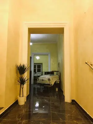 a hallway with a tub in a room with a plant at B&B Roma Royal Residence in Rome