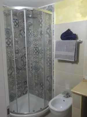 a bathroom with a shower and a toilet at B&B Roma Royal Residence in Rome