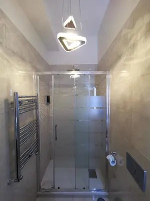 a shower with a glass door in a bathroom at B&B Roma Royal Residence in Rome