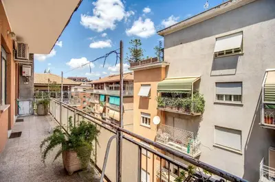 an apartment balcony with a view of a building at Homely - spacious Apt in gianicolo district in Rome