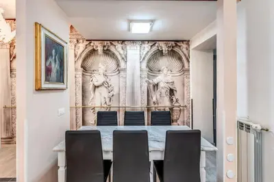 a dining room with a table and chairs at Maison St Camillo Rome Centre in Rome