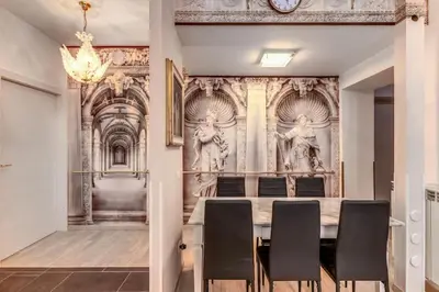 a dining room with a table and chairs at Maison St Camillo Rome Centre in Rome