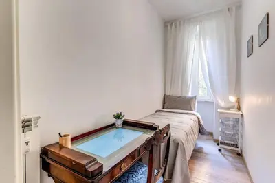 a room with a tub in the middle of a bedroom at Maison St Camillo Rome Centre in Rome