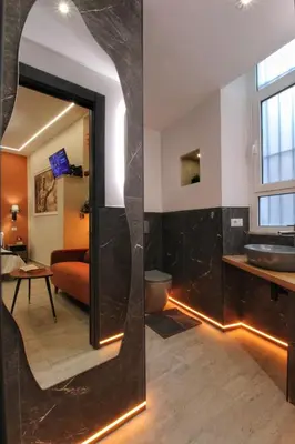 a bathroom with a sink and a mirror at Domus Grottae at Campo de fiori in Rome