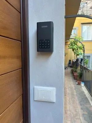 a remote control on the side of a building at Domus Romano Piazza Farnese in Rome