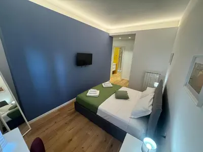 a small room with a bed and a television at Roman Pearl in Portuense in Rome