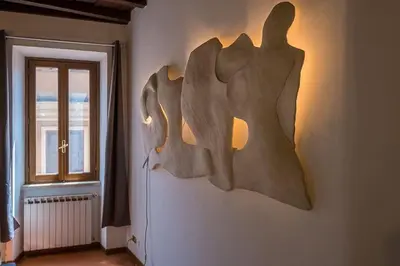 a wooden object on the wall of a room at ht vicolo 6 bilo in Rome