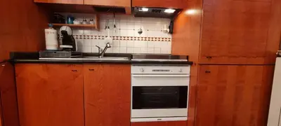 a kitchen with a sink and a stove at Er Core Nostro in Rome