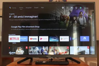a flat screen tv sitting on top of a wooden table at Anita's House in Rome