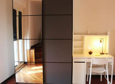 a room with a desk and a table with a chair at Anita's House in Rome