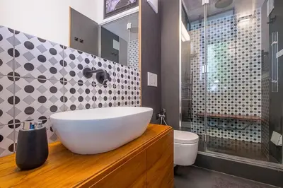 a bathroom with a white sink and a toilet at HT Borromini Penthouse in Rome