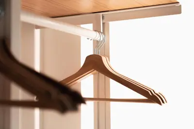 a bird standing on a hanger in front of a window at Emma Bliss Apartment in Rome