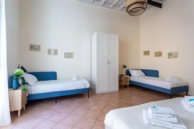 a room with two beds in a room at iFlat Space and Comfort in the Heart of Monti in Rome