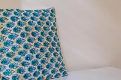 a pillow with a blue and white flower pattern at iFlat Space and Comfort in the Heart of Monti in Rome