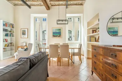 a living room with a couch and a table at iFlat Space and Comfort in the Heart of Monti in Rome
