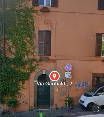 a building with a car parked in front of it at Trastevere Elite 