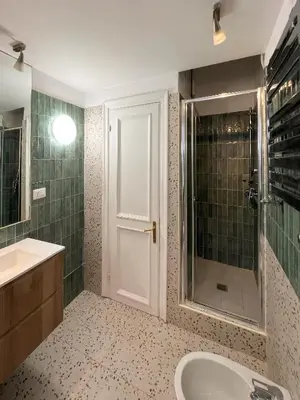 a bathroom with a tub and a sink and a shower at Trastevere Elite 
