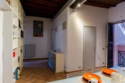 a room with a table with plates on it at PANTHEON LARGE APARTMENT IN THE HEART OF ROME s in Rome