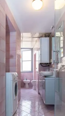 a bathroom with a sink and a washing machine in it at PANTHEON LARGE APARTMENT IN THE HEART OF ROME s in Rome