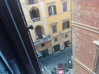 a view of a street from a window of a building at PANTHEON LARGE APARTMENT IN THE HEART OF ROME s in Rome