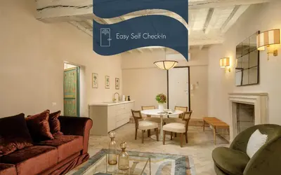 a living room with a couch and a table at Daplace - Camelia Apartment in Rome