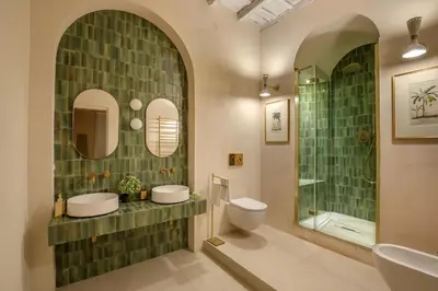 a bathroom with two sinks and a shower and a toilet at Daplace - Camelia Apartment in Rome