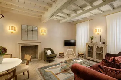 a living room with a couch and a table at Daplace - Camelia Apartment in Rome