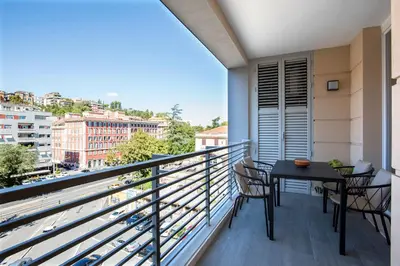 a balcony with a table and chairs and a view at Sky Luxury in Rome