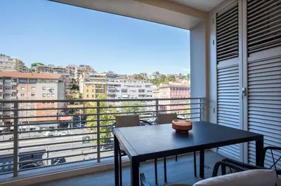 a balcony with a table and a view of a city at Sky Luxury in Rome